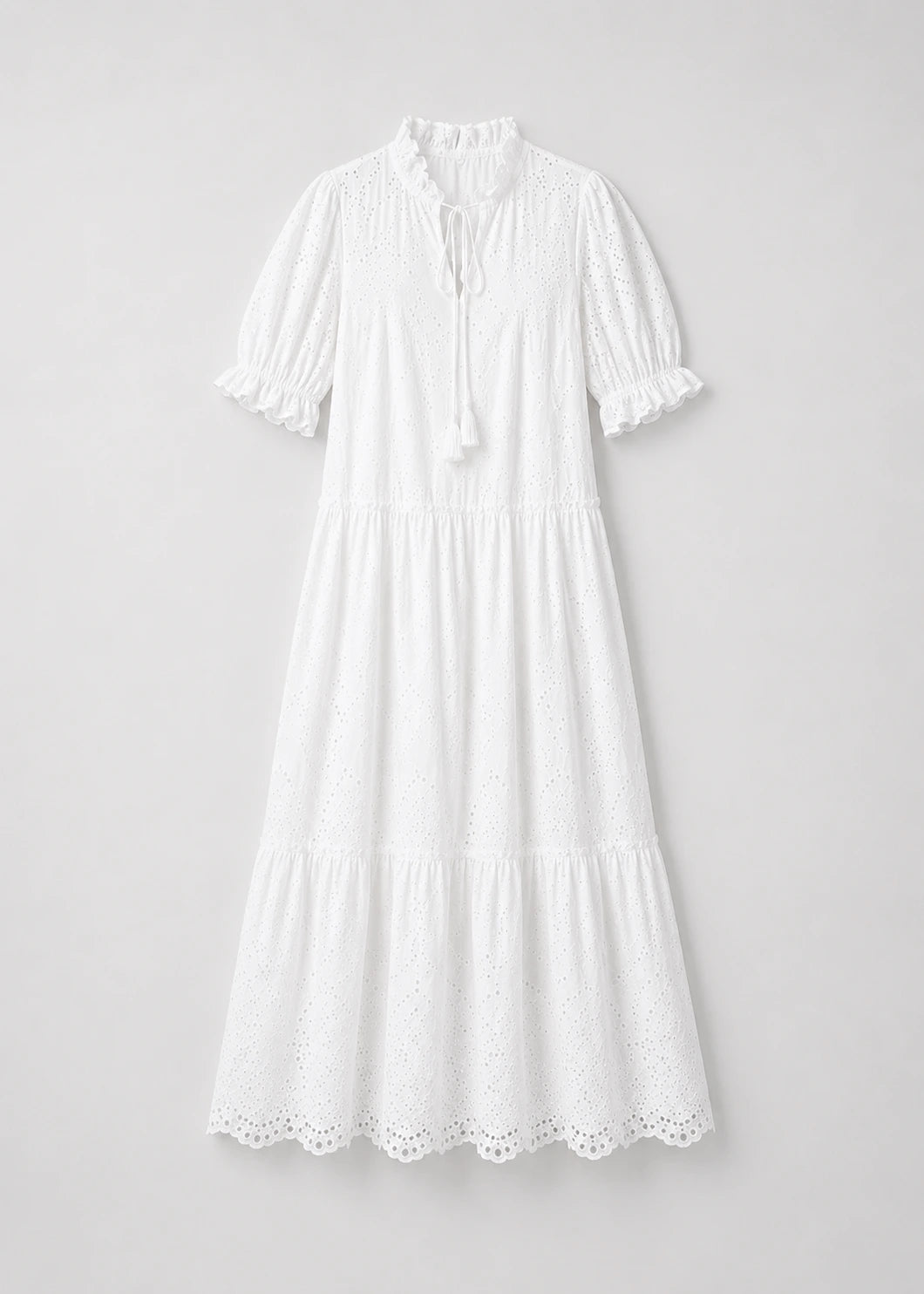 Vestido blanco bordado con lazo frontal
