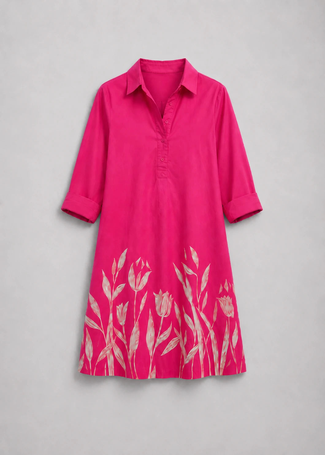 Vestido fucsia con cuello camisero y bajo floral